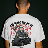 Person wearing a white t-shirt with a graphic design on the back featuring a grim reaper and a car, with text 'E36 MADE ME DO IT'.