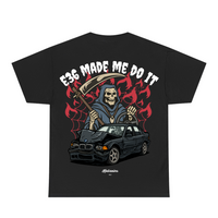 Black t-shirt with a graphic design of a grim reaper and a car, with text 'E36 MADE ME DO IT' on a white background.